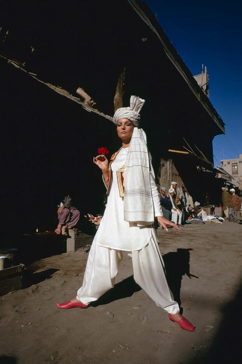 Vogue model wearing a white tunic and turban.